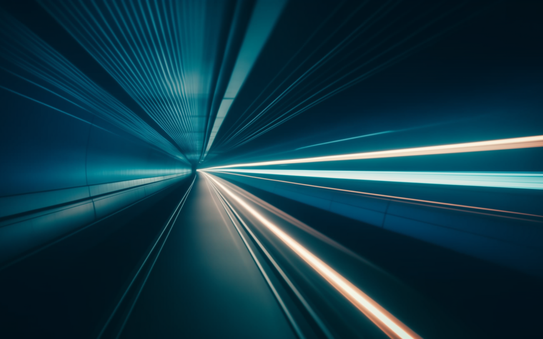 Digital healthcare equity can be achieved through digital training and digital adoption for patient populations. Image is a dark tunnel with blue and white lights streaming toward a central focal point.